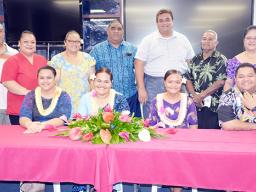 The 4 graduates (seated) and Scholarship Board chairman, Sen. Fai’ivae Godinet and co-chair Donna Gurr recognized the four students and their parents (standing)