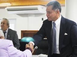 Local Department of Homeland Security director Samana Semo Ve’ave’a shaking hands with senators following a Senate committee hearing