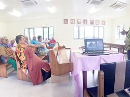 Pulenuu watching presentation