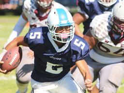 Fitu Amata Jr. of Samoana carrying the ball
