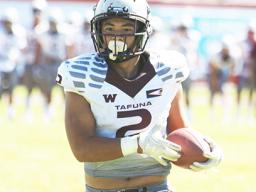 Tafuna Warriors Koison Ozu with the ball