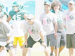 LJ Solo and his assistants in their ‘Tackle Cancer’ uniforms