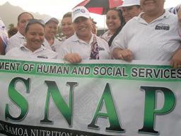 SNAP staff with sign