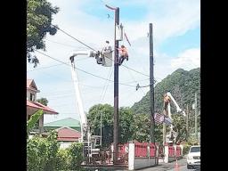 ASPA workers in a bucket truck installing streetlights.