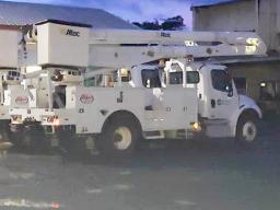 Two newly acquired bucket-trucks at the ASPA compound