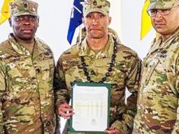 Alexander Francis Atuatasi (center)