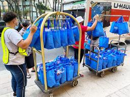 Bags of donations being wheeled to truck for delivery to quarantine center in Honolulu.