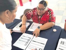 election offficial explaining the ballot
