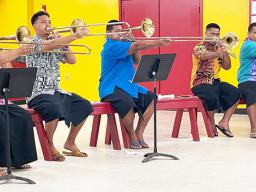 5 young trombone players