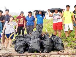 Young people with bags of rubbish picked up