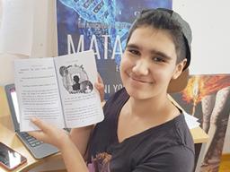 Bella Young displays one of her illustrations