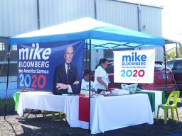 Local supporters for US democratic presidential hopeful, billionaire businessman Mike Bloomberg at their campaign booth.