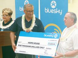 In the presence of the residents that were able to take part including the staff, management and Hope House board members, the Bluesky team presents their donation