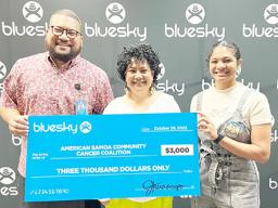 Blusky presenting donation check to ASCCC