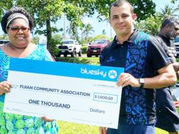 Bluesky presents $1,000 check