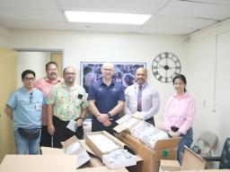 boxes of glasses with lbj staff and doner