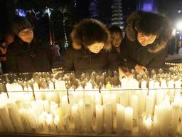 Buddhist light candles for New Year 2019
