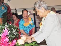 First Lady Cynthia Malala Moliga lights a candle during last Thursday’s Candlelight Memorial for World Suicide Prevention Day