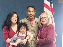 Capt. Paunga with his wife, mother and son