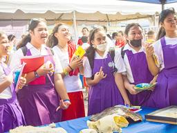 Studfents at an information booth curing Environmental Career Day