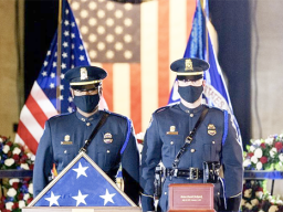 The Capitol Police Force honor guard with flag and ashes