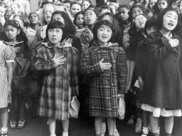 children at the Weill public school in San Francisco recite the Pledge of Allegiance. Some of them are evacuees of Japanese ancestry who will be housed in War Relocation Authority centers for the duration of World War II.
