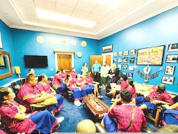 close up delegates in Amata's office