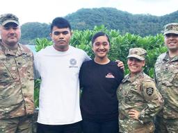 Cody McMoore (2nd from left) and Florine Roe (center) 