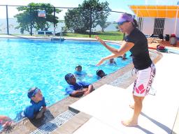 Debbs Cox instructs the PHS's Adventurer Class (Grades 4 & 5) on the correct flutter kick.