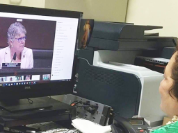 Aumua Amata speaking remotely with  Task Force Chairwoman Julia Brownley