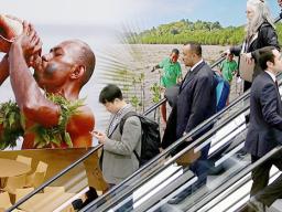  Visitors use an escalator past a poster featuring the Fiji Islands on the opening day of the COP 23 United Nations Climate Change Conference on November 6, 2017 in Bonn, Germany