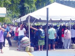 People crowded under the tents at Social Services in Utulei on Monday, April 20 for apparently Gita relief money.