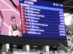 the screen-score board of the results of the men’s 100 meter sprint
