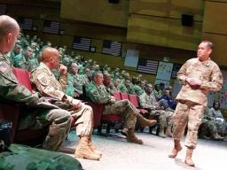 Retired Command Sergeant Major Charles Tobin (standing, right) 