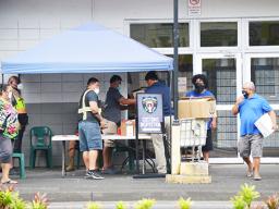 People lined up at customs check point at USPS