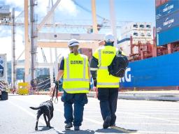 CUSTOMS AGENTS WITH DOG