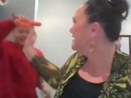 Son with carrot and mom trying to grab it