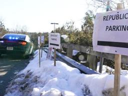 Parking lot with signs saying Republican parking and Democrat parking
