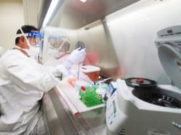 State Microbiologist Mark Nagata demonstrates extracting nucleic acid at the Hawaii State Laboratory