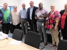 USDA Western Regional Administrator Jesus Mendoza (4th from left) with DHSS director Muavaefaatasi John E. Suisala (4th from right) and his staff in