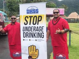 DHSS staff with prevent underage drinking sign