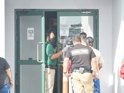District Court house security check line at front door