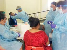 DoH staff at the Department of Youth and Women’s Affairs facility in Pago Pago conducting daily testing