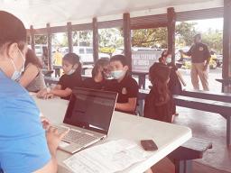 Children line up to get COVID vaccine