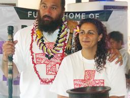 Denver Bronco’s Domata Peko (left) and his wife Ann