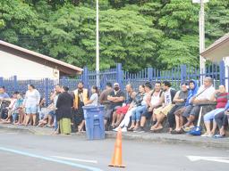 Crowds of people waiting for their Child Tax Credit payments in front of Lee Auditorium
