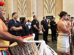 Scores of Polynesian dancers welcome Momoa