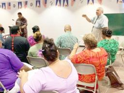 Chief Election Officer, Dr. Lealofi Uiagalelei with poll workers in a file photo taken prior to the election. 