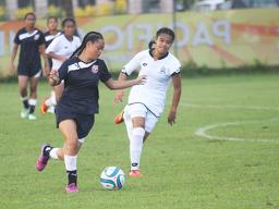 Eliza Berondo of Amercan Samoa dribbles the ball