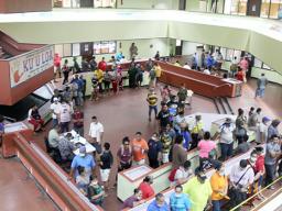 A view of the atrium at the EOB crowded with people